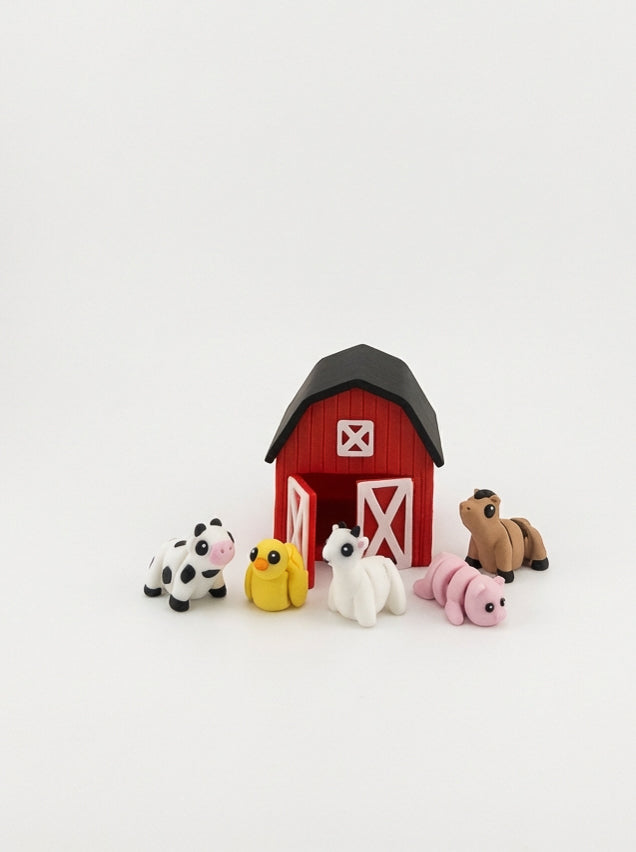 All Barn Farm animal figures fitting inside the barn container for easy cleanup and travel