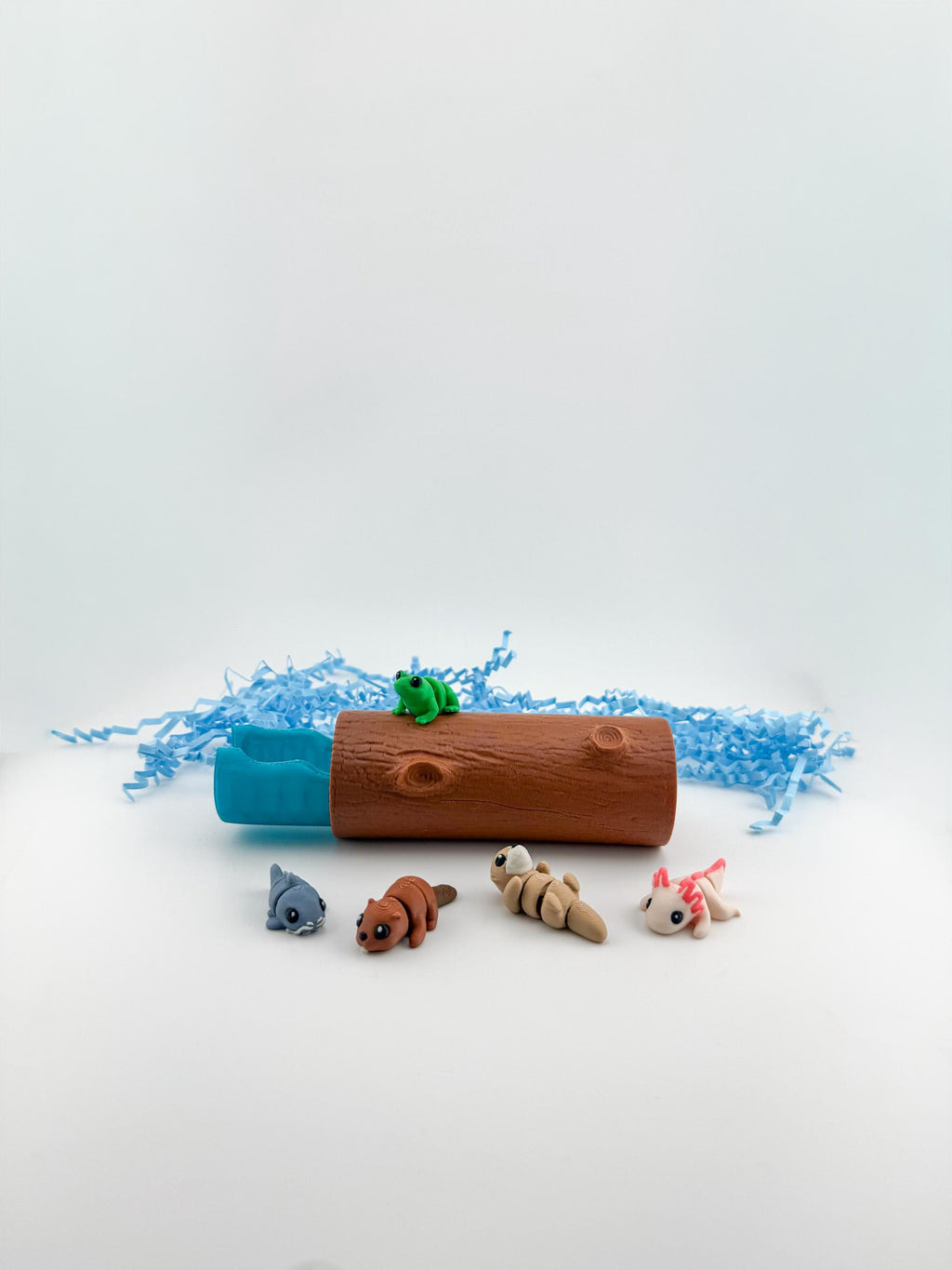 All Freshwater Log animal figures fitting inside the log container for easy cleanup and travel