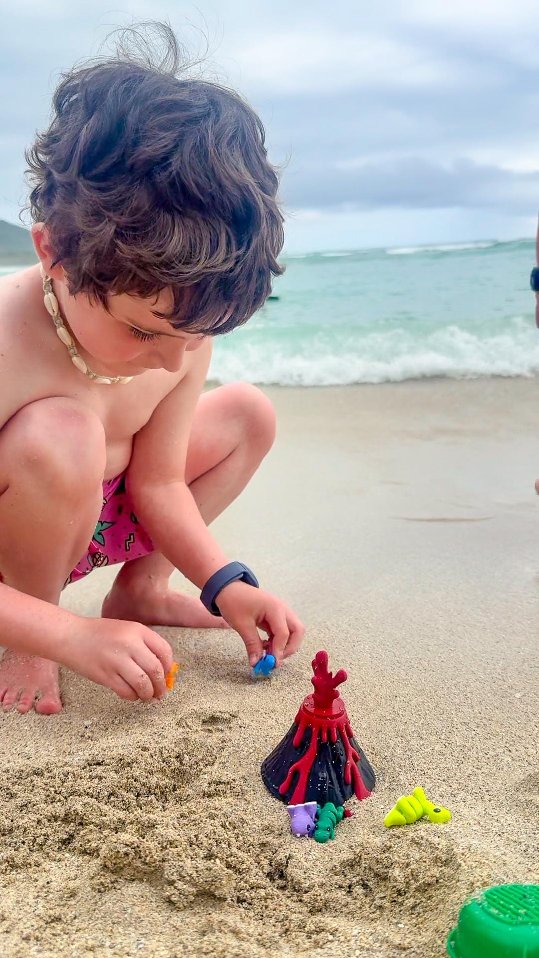 Durable Volcano Dinosaur CritterPod container open and closed - kid-friendly travel toy design